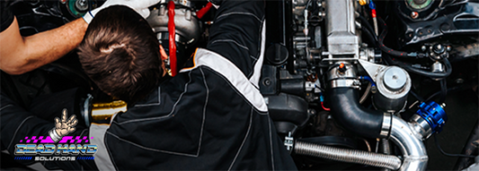 Fabricator working on car