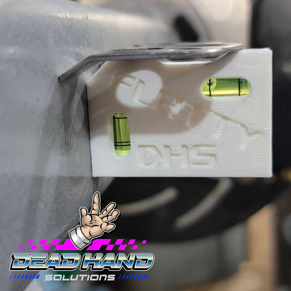 Dead Hand Solutions Chassis Speed Jig in use on thin-wall tubing, positioning a Dzus quarter-turn fastener tab for welding on a lightweight tube chassis