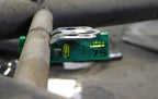 Dead Hand Solutions Chassis Speed Jig clipped onto small-diameter tubing holding a Dzus tab flush, demonstrating use on sprint car chassis fabrication